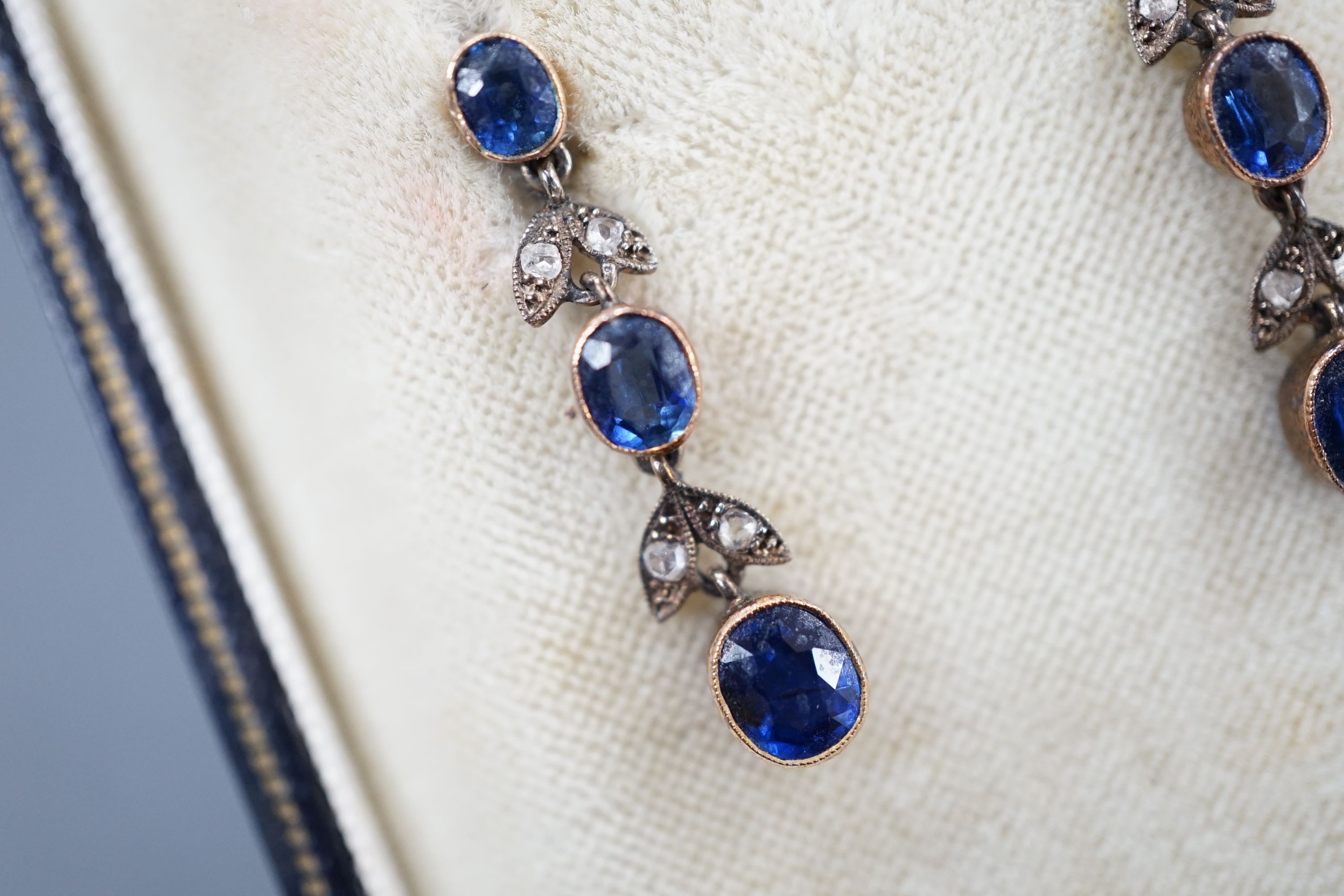 A pair of late Victorian 9ct, three stone sapphire and four stone rose cut diamond set drop earrings, 25mm, gross 3.1 grams.